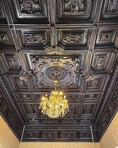 a chandelier hanging from the ceiling in a room