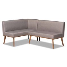 the corner sofa is made from wood and has grey fabric upholstered to it