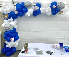 an arch made out of balloons and baseballs