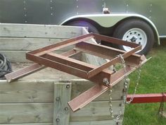 the back end of a trailer with chains attached to it