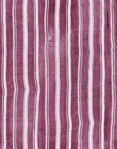 a purple and white striped rug with vertical stripes