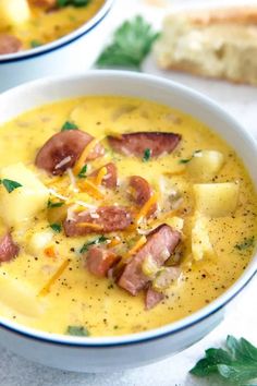 two bowls of soup with ham and potatoes