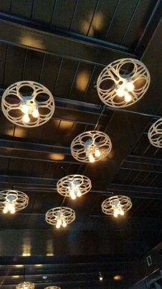 the lights are hanging from the ceiling in the room