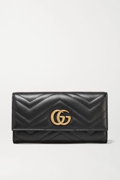 A continental wallet is key to keeping organized. Gucci's 'GG Marmont' version has been made in Italy from quilted leather and topped with the label's signature interlocking 'GG' plaque. Its dual-compartment interior is equipped with card slots, sleeves and a zipped pouch. Gucci Pouch Bag, Gucci Wallet Women, Ysl Handbags, Gucci Marmont Bag, Horsebit Loafers, Miu Miu Handbags, Givenchy Handbags, Quilted Wallet, Latest Bags