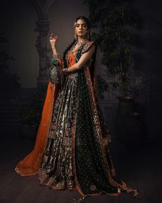 Green Lehenga with Choli and Open Gown Bridal Dress is a Traditional masterpiece adorned with Hand-crafted embellishments and Luxury designs. Custom sizes. Lehenga Designs For Women, New Lehenga Designs, Green Bridal Lehenga, Dark Green Lehenga, Skirt Lehenga, Bridal Mehndi Dresses, Pakistani Bridal Dress, Mehendi Outfits, Desi Wedding Dresses