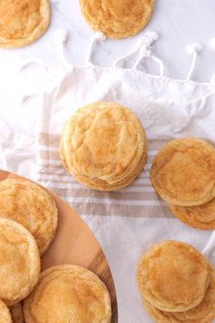 some cookies are sitting on a wooden plate