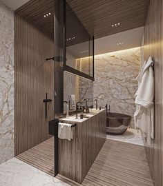 a bathroom with marble walls and flooring next to a bathtub in the corner