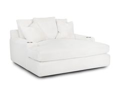 a white couch with pillows on it