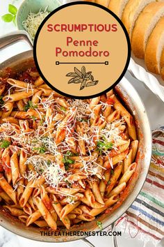 a pan filled with pasta covered in sauce and parmesan cheese next to bread