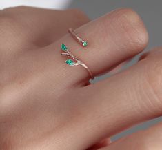 Shop our beautiful Original 925 Silver two green Ivy Olive Shaped Leaf Ring on Etsy. This dainty and elegant ring is handmade with love and care, featuring a unique olive tree design. Wear it as a symbol of protection against the evil eye, or simply as a stylish accessory for everyday wear. This stackable ring makes a perfect gift for birthdays, Christmas, or for your best friend. Invest in your beauty and add this handmade leaf design tree branch ring to your jewelry collection today! Find the perfect gift for your loved one with our minimalist heart shape infinity necklace. This elegant piece of jewelry is a symbol of eternal love and makes a great Valentine's Day or anniversary present. Add a touch of romance to your outfit with this beautiful necklace, handmade with care and attention Green Open Ring For Promise, Green Dainty Jewelry For Promise, Dainty Green Birthstone Open Ring, Rose Gold Emerald Open Ring Gift, Emerald Flower Ring Gift In Green, Delicate Green Rings For Promise, Green Open Flower Ring For Promise, Delicate Green Promise Ring, Dainty Green Rings For Gift