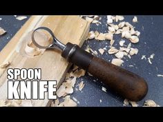 spoon knife with wood shavings on it and the words spoon knife overlayed