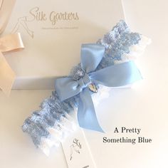 "Hali bridal garter, exclusive to 'Silk Garters'. 😍 Love this shimmering blue lace! This pretty something blue garter is a layer of pale ivory(off white) floral lace, with two rows of shimmering blue crochet lace and a row of chiffon ribbon. A matching blue bow and crystal, make this a lovely garter for your 'something blue'! Made in two comfortable sizes 14\"-22\" and a plus size 20\"-26\" the garter is designed to still have a little ruffle in the organza when it's worn. This garter would be Blue Garter Belt, Blue Wedding Receptions, Baby Blue Weddings, Bride Garter, Wedding Garter Blue, Nottingham Lace, Wedding Garter Lace, Blue Garter, Chiffon Ribbon