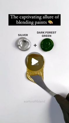 a person holding a spoon with some paint on it and the caption says, the captivating allure of blending paints silver + dark forest green