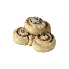 four cinnamon rolls with icing sitting on top of each other