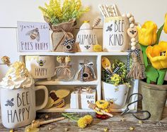 a table topped with mugs filled with different types of flowers and decorations on top of it