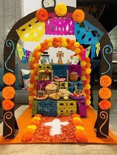 an altar decorated with orange flowers and decorations