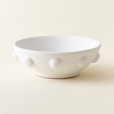 a white bowl sitting on top of a table