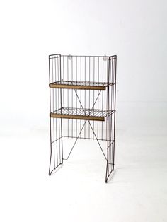 a wire shelf with two shelves on each side