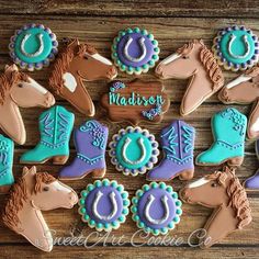 decorated cookies are arranged in the shape of horses