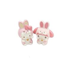 two pink and white bunny dolls sitting next to each other