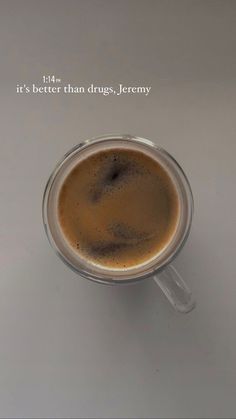 a cup of coffee sitting on top of a table