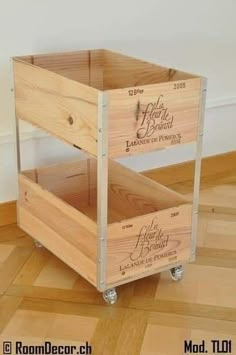 two wooden crates sitting on top of a hard wood floor