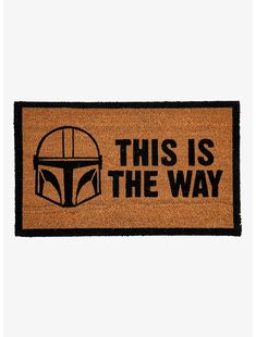 this is the way door mat with star wars symbol on it, brown and black