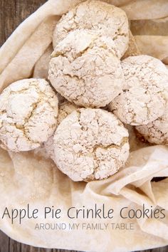 apple pie crinkle cookies are in a white bowl on top of a wooden table