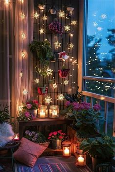 a room filled with lots of plants and candles in front of a window covered in snowflakes