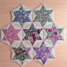 the star is made up of many different colors and sizes, including pink, blue, purple