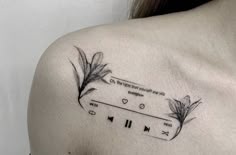 the back of a woman's shoulder with an arrow and musical notes on it