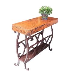 an old iron and wood table with a planter on it's shelf, isolated against a white background