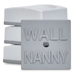 three white wall plaques with the words wall nanny written on one side and two smaller ones in the other