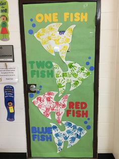 the door to one fish is decorated with different colors and shapes, including letters that spell out two fish