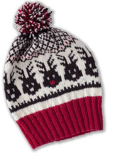 a red and white knitted hat with a pom - pom