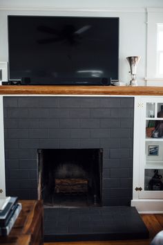 a fireplace with a flat screen tv above it