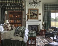 a bedroom with a bed, chair and fireplace in it's centerpieces