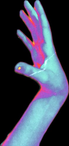 an image of a person's hand with blue and pink colors on it, showing the thumb area