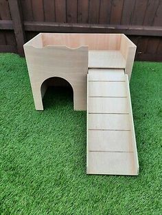 a wooden bench sitting on top of green grass