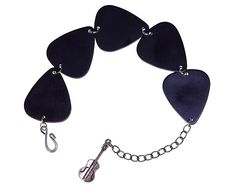 five guitar picks are attached to a chain