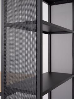 a black shelf with three shelves on each side