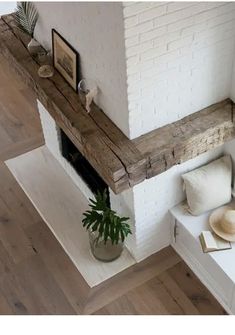 a living room with a fireplace and white walls