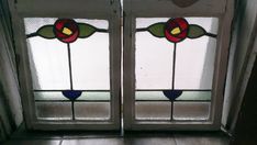 two stained glass doors with flowers on them