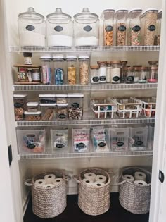 an organized pantry with baskets and containers