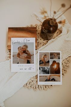 a couple's wedding photos are displayed on a table next to an envelope and candle