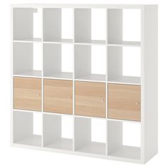 a white bookcase with wooden drawers on the front and bottom shelves in different colors