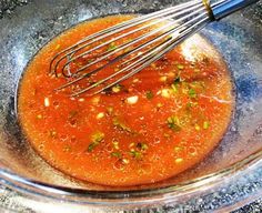 the sauce is being whisked into the bowl with some other ingredients in it