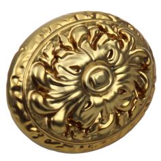 an ornate gold door knob on a white background