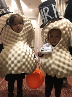 two children dressed up in costumes for halloween