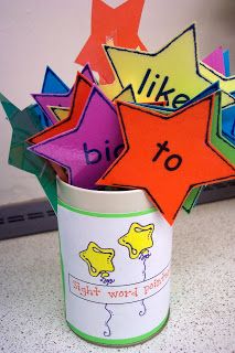 a cup filled with colorful paper stars on top of a counter